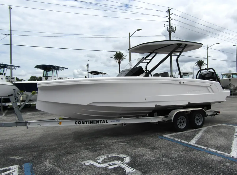 Slide: The Image of 2022 Axopar 22 T-Top boat on trailer in parking lot. - 5