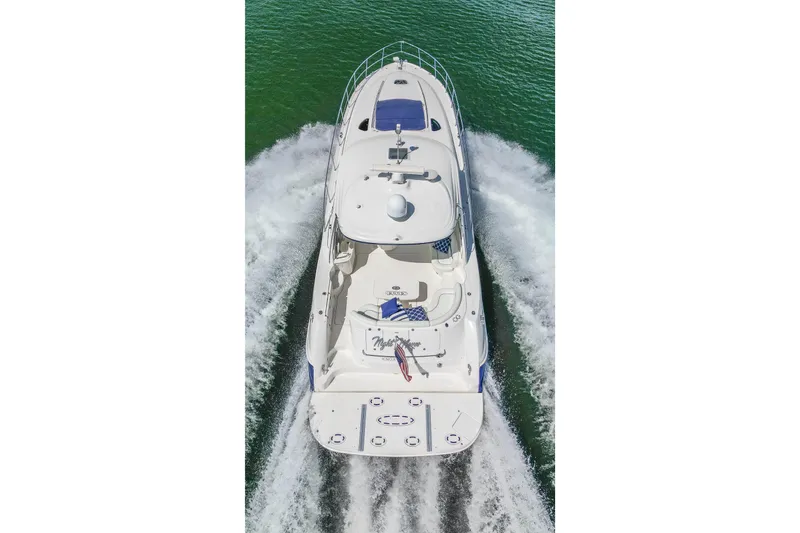 Slide: The Image of 2005 Sea Ray 500 Sundancer yacht cruising on open water, aerial view. - 22