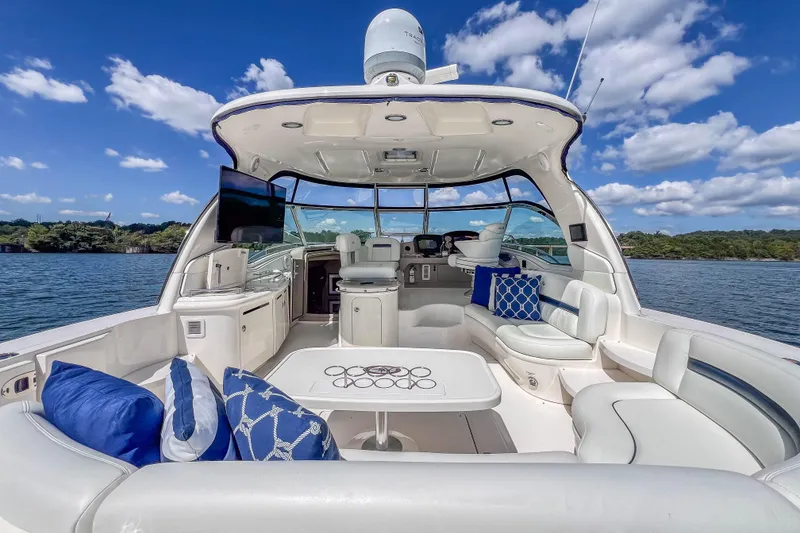Slide: The Image of Luxurious 2005 Sea Ray 500 Sundancer yacht interior with plush seating and scenic water view. - 24