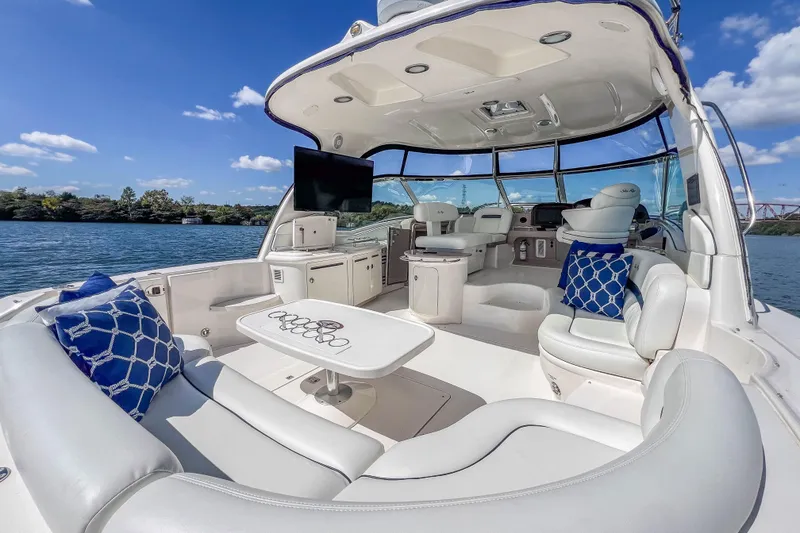 Slide: The Image of Luxurious 2005 Sea Ray 500 Sundancer yacht interior with plush seating and scenic water view. - 25