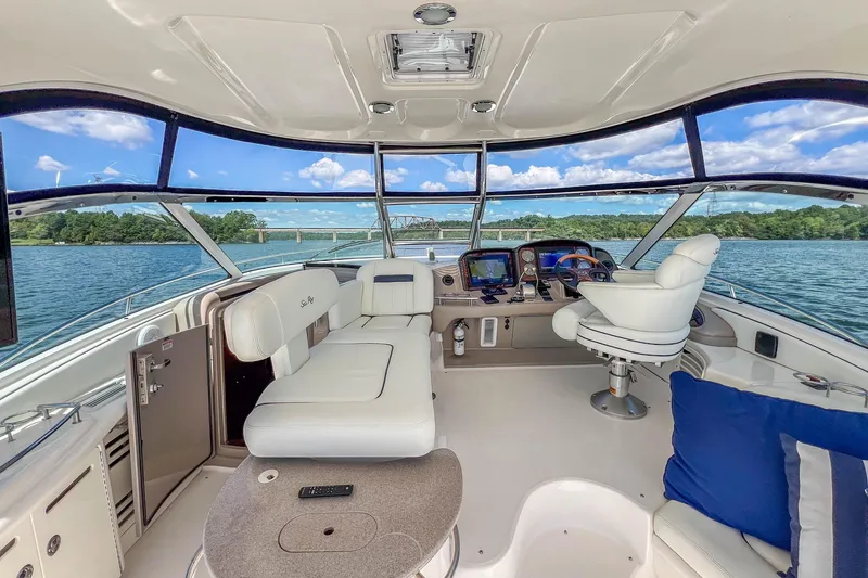 Slide: The Image of Luxurious 2005 Sea Ray 500 Sundancer yacht interior with plush seating and scenic water view. - 27