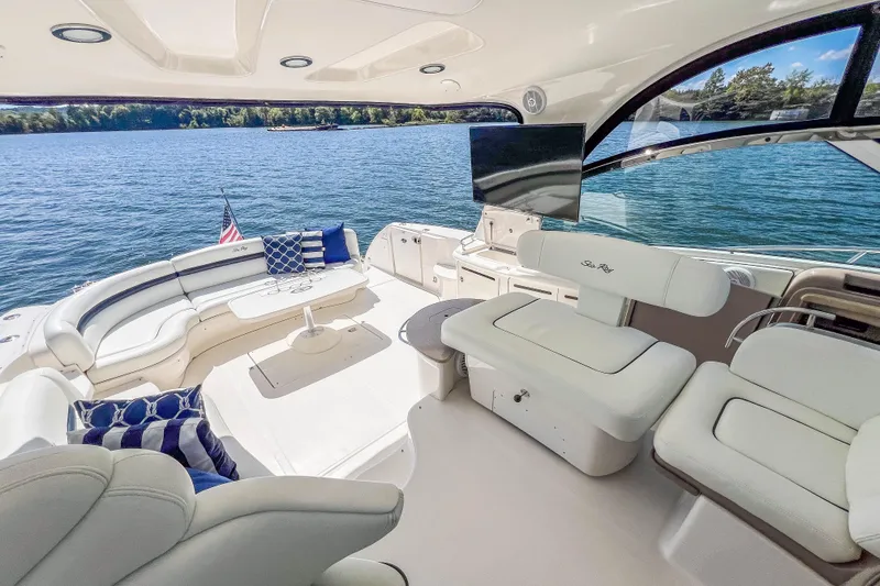 Slide: The Image of Luxurious 2005 Sea Ray 500 Sundancer yacht interior with plush seating and scenic water view. - 31