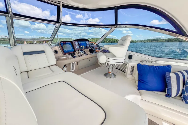 Slide: The Image of Luxurious 2005 Sea Ray 500 Sundancer yacht interior with plush seating and scenic water view. - 33