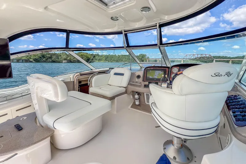 Slide: The Image of Luxurious 2005 Sea Ray 500 Sundancer yacht interior with panoramic windows and plush seating. - 34