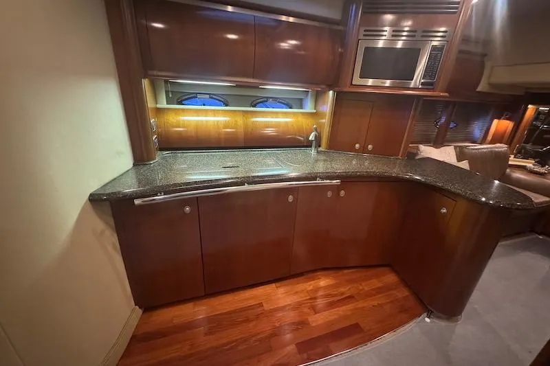 Slide: The Image of Luxurious 2005 Sea Ray 500 Sundancer yacht interior with sleek kitchen design. - 43