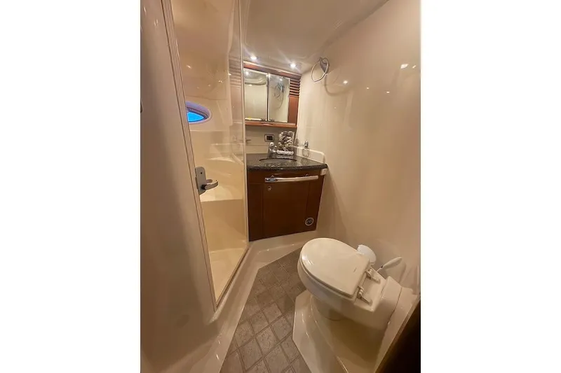 Slide: The Image of 2005 Sea Ray 500 Sundancer yacht bathroom with shower, sink, and toilet. - 47