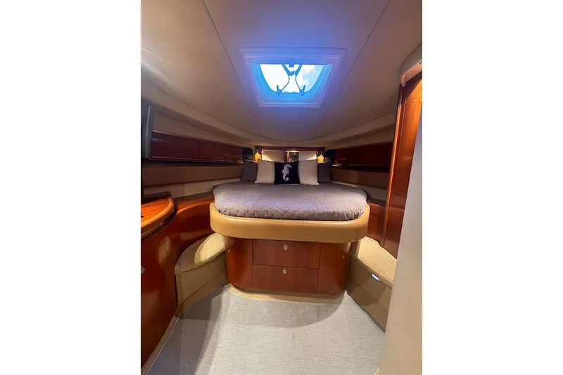 Slide: The Image of Luxurious cabin interior of 2005 Sea Ray 500 Sundancer yacht with skylight and cozy bed. - 49