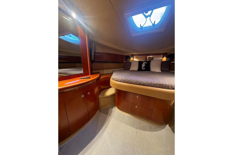 Slide: The Image of Luxurious cabin interior of 2005 Sea Ray 500 Sundancer yacht with elegant wood finish. - 50