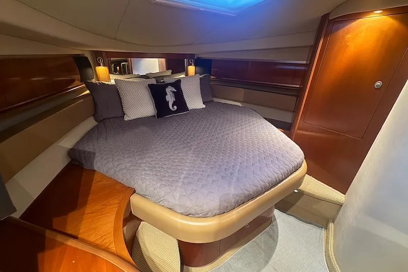 Slide: The Image of Luxurious cabin interior of 2005 Sea Ray 500 Sundancer yacht with cozy bedding. - 51