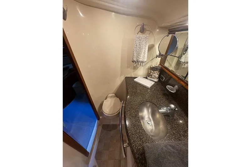 Slide: The Image of Bathroom interior of 2005 Sea Ray 500 Sundancer yacht with sink and toilet. - 55