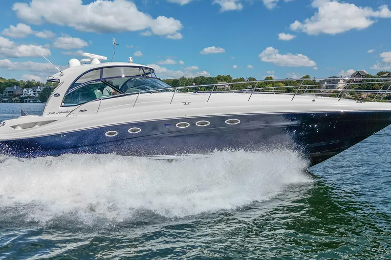 Slide: The Image of 2005 Sea Ray 500 Sundancer yacht cruising on a sunny day with blue skies. - 9