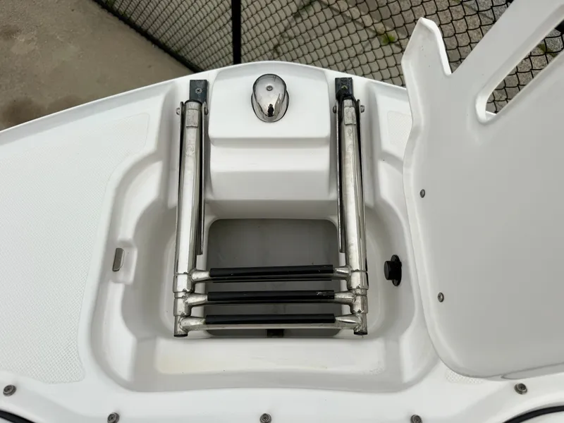Slide: The Image of A 2022 Regal 23 OBX boat featuring a built-in swim ladder at the bow area. - 19