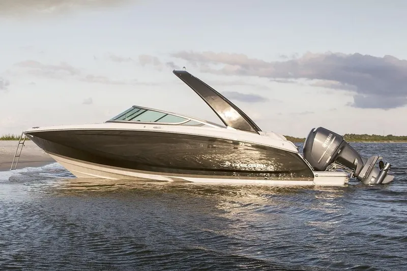 Slide: The Image of 2019 Regal 23 OBX boat on water at sunset. - 40