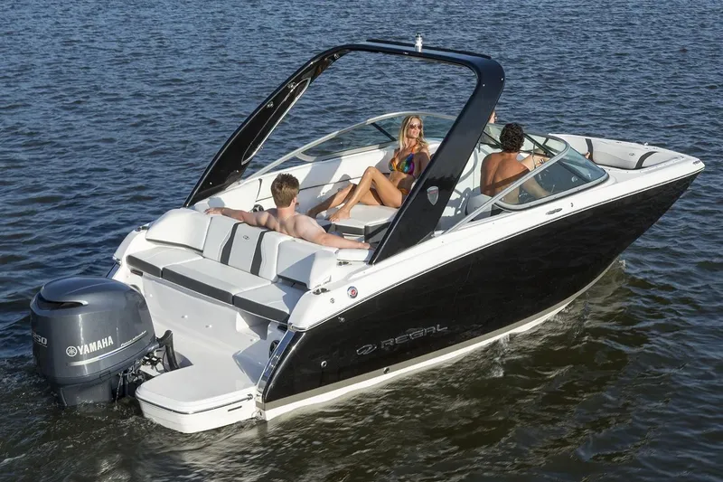 Slide: The Image of 2019 Regal 23 OBX boat cruising with passengers on a lake. - 41