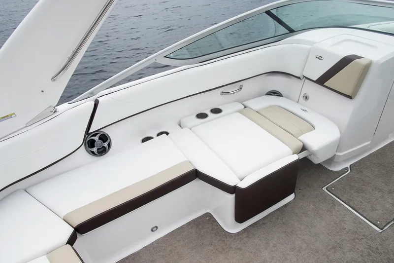 Slide: The Image of 2019 Regal 23 OBX boat interior with white and beige seating. - 45