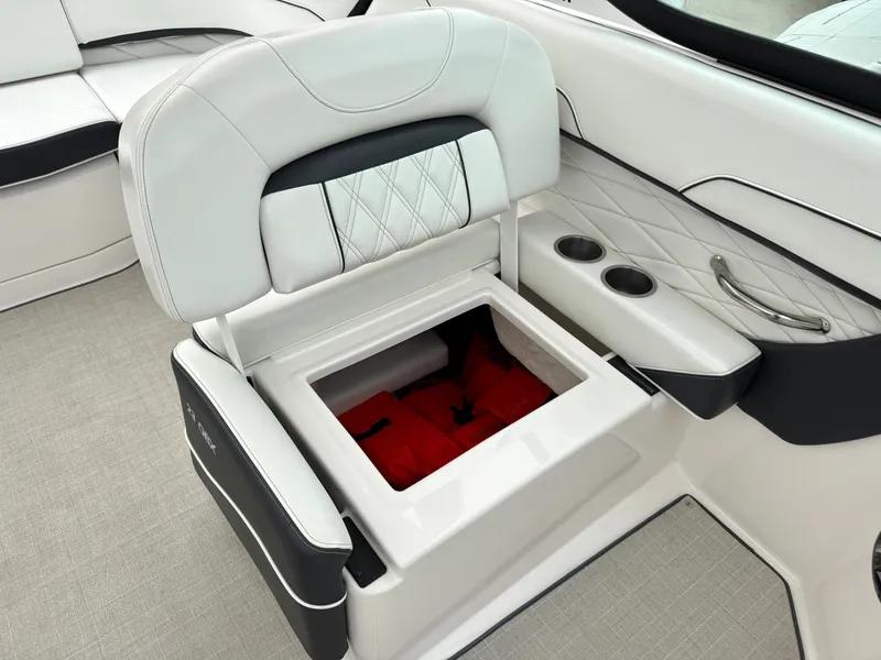 Slide: The Image of A white boat seat with storage underneath, containing red life jackets. - 11