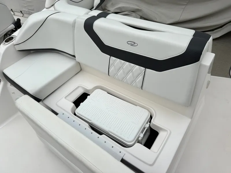 Slide: The Image of The 2022 Regal 23 OBX features a sleek white bench seat with integrated storage. - 4