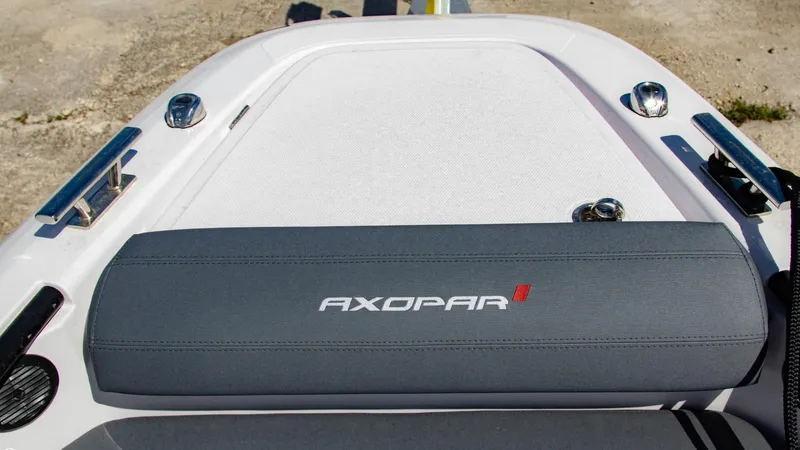 Slide: The Image of 2023 Axopar 22 T-Top boat deck with branded cushion. - 11