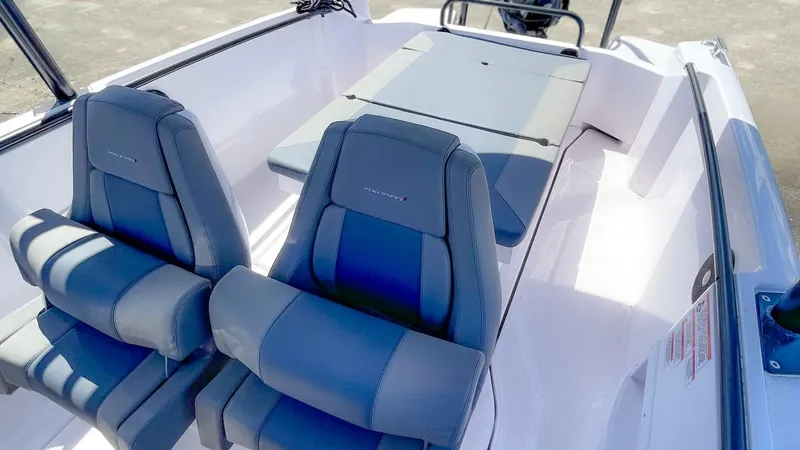 Slide: The Image of 2023 Axopar 22 T-Top boat interior with stylish seating and modern design. - 7