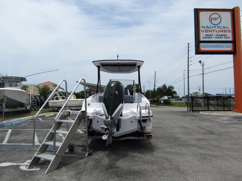 Slide: The Image of 2024 Axopar 25 Cross Top boat displayed at Nautical Ventures dealership. - 3