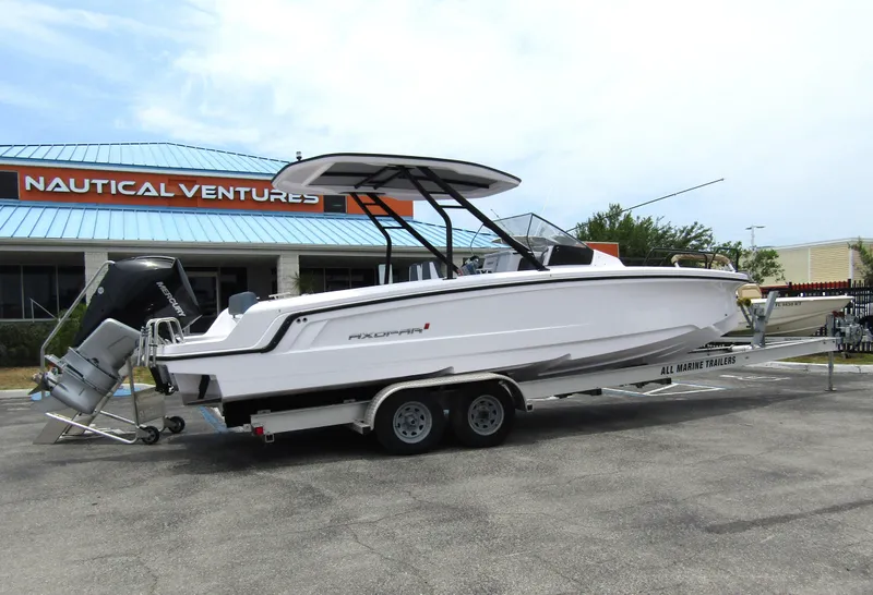 Slide: The Image of 2024 Axopar 25 Cross Top boat on a trailer at Nautical Ventures. - 4