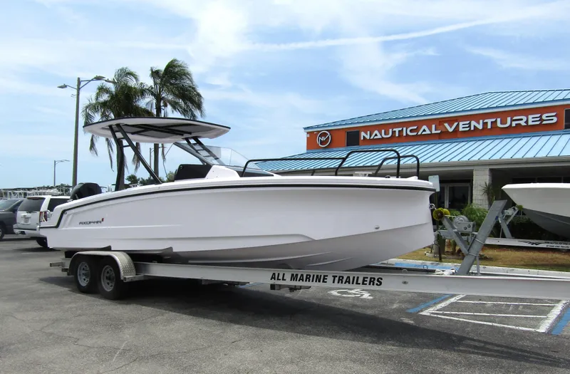 Slide: The Image of 2024 Axopar 25 Cross Top boat on trailer at Nautical Ventures dealership. - 6