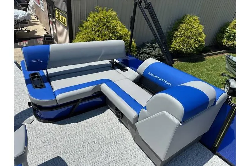 Slide: The Image of 2026 Bennington 23 SSB Swing Back Pontoon with blue and gray seating. - 12