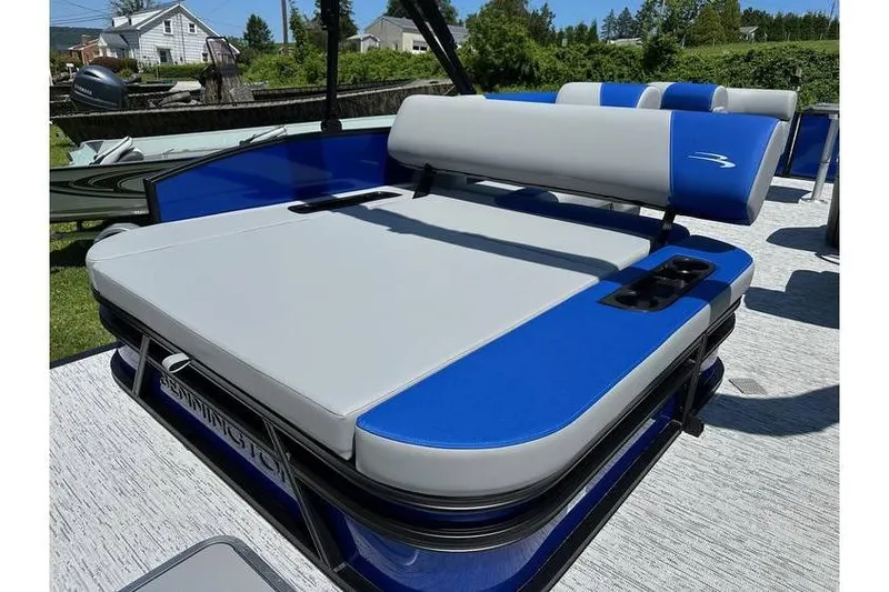 Slide: The Image of 2026 Bennington 23 SSB Swing Back Pontoon with blue and gray seating on deck. - 18