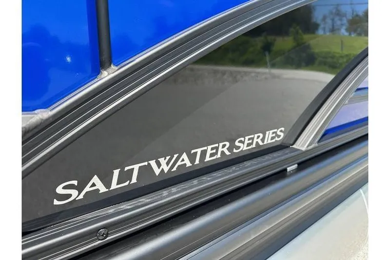 Slide: The Image of 2026 Bennington 23 SSB Swing Back Pontoon, Saltwater Series detail, blue and black design. - 7