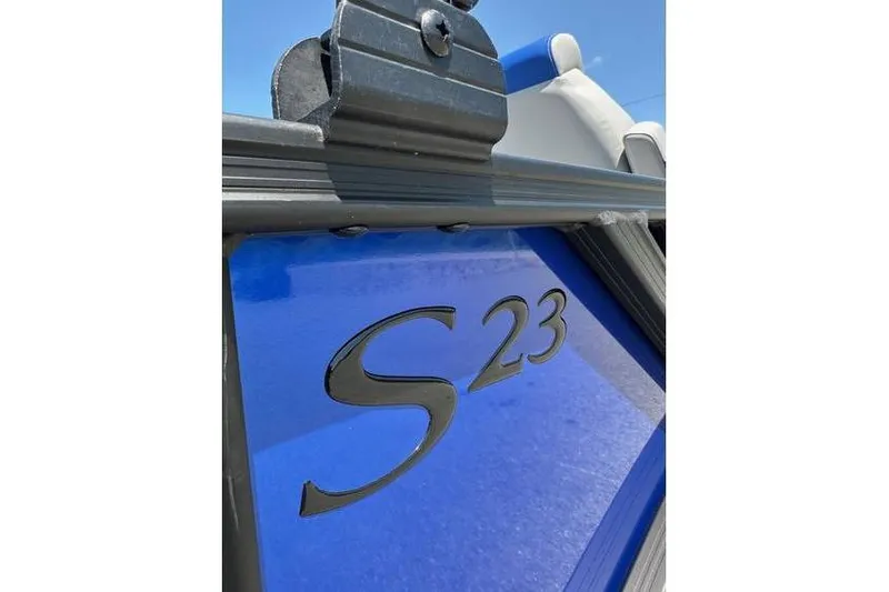 Slide: The Image of 2026 Bennington 23 SSB Swing Back Pontoon, blue panel with "S23" emblem. - 8
