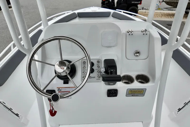 Slide: The Image of Steering console of 2026 ALK2 23 CRX boat with controls and cup holders. - 12