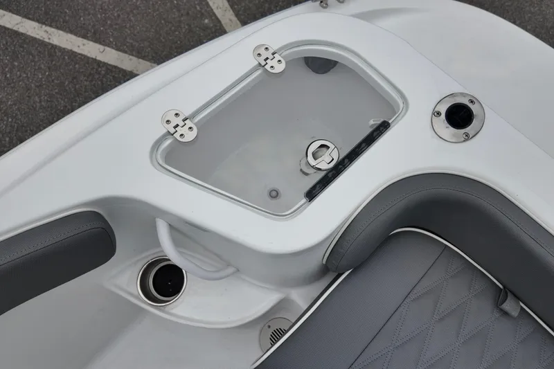 Slide: The Image of Interior view of ALK2 23 CRX 2026 boat, featuring seating and storage compartment. - 13