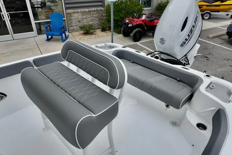 Slide: The Image of Interior of 2026 ALK2 23 CRX boat with gray seating and Suzuki outboard motor. - 15