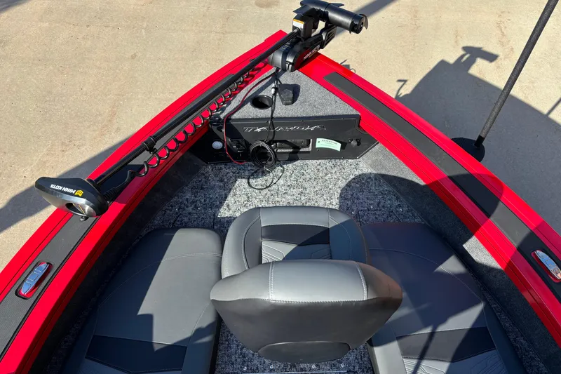 Slide: The Image of 2026 Tracker Targa V-19 Combo boat interior with seating and trolling motor. - 4