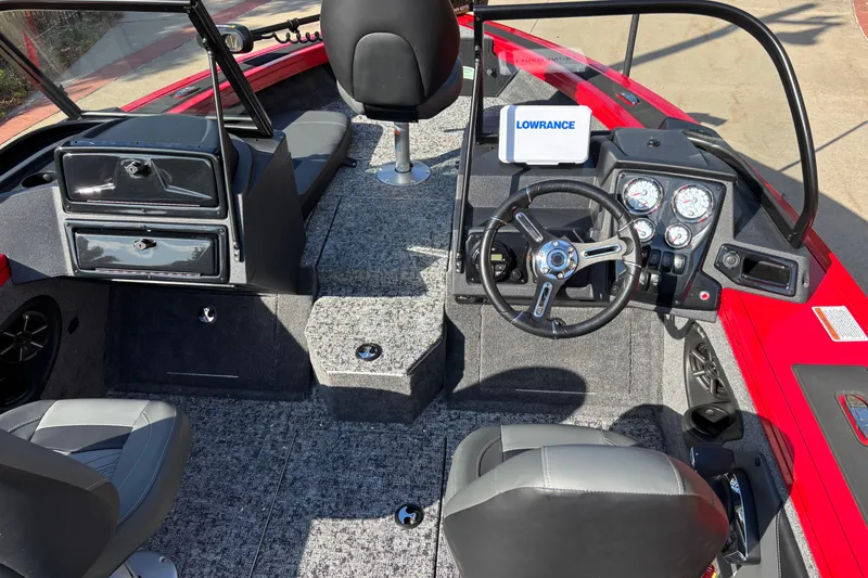 Slide: The Image of 2026 Tracker Targa V-19 Combo boat interior with steering wheel and dashboard controls. - 6