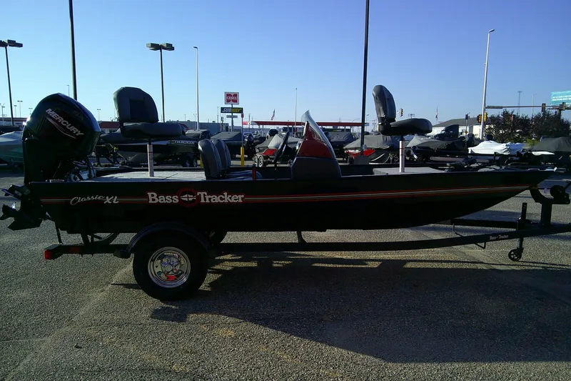 Slide: The Image of 2026 Tracker Bass Tracker Classic XL boat on trailer in outdoor dealership. - 4