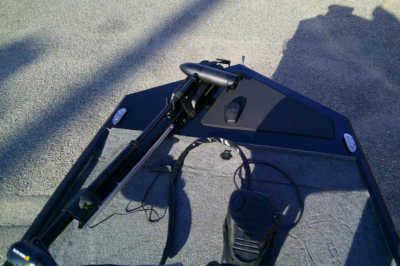 Slide: The Image of 2026 Tracker Bass Tracker Classic XL boat deck with trolling motor and foot pedal. - 7