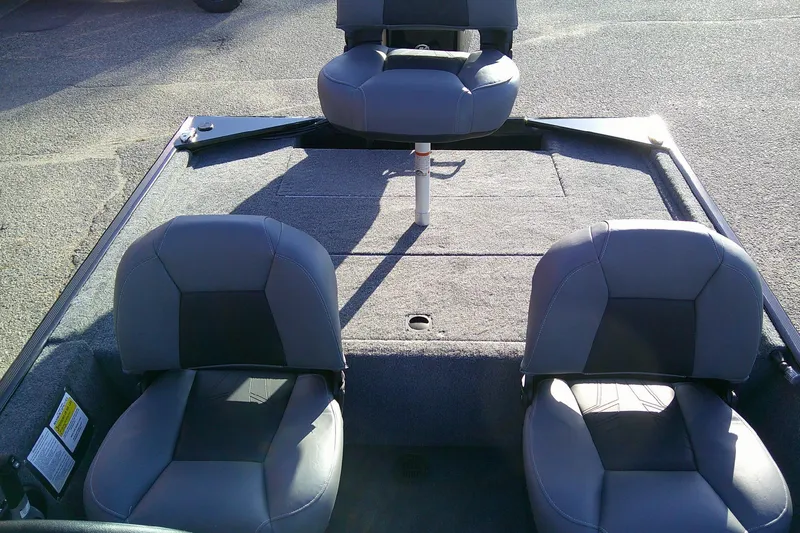 Slide: The Image of 2026 Tracker Bass Tracker Classic XL boat interior with three gray seats. - 9