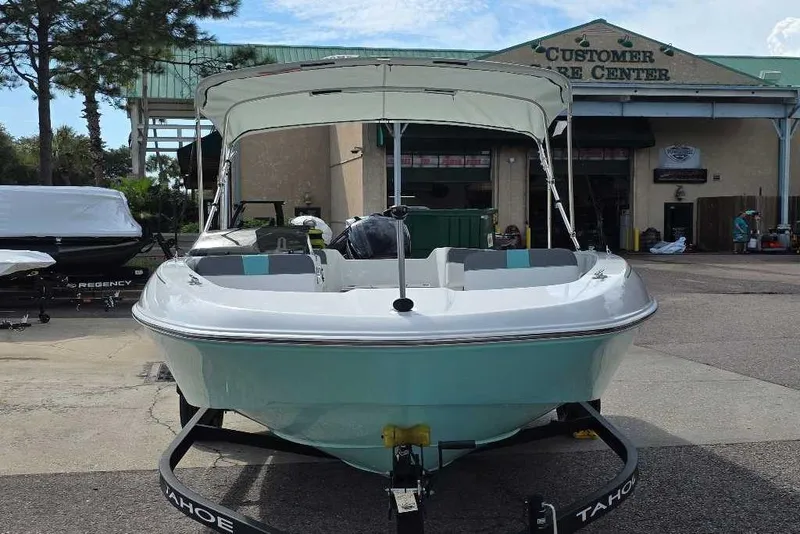 Slide: The Image of Steering console of 2026 Tahoe T18 boat with modern controls and display. - 2