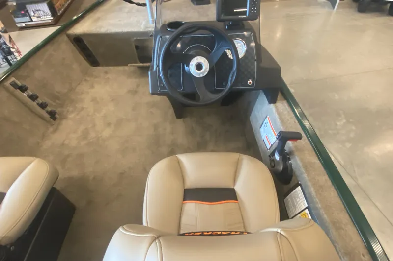 Slide: The Image of 2026 Tracker Bass Tracker Classic Limited boat interior with steering wheel and seating. - 5