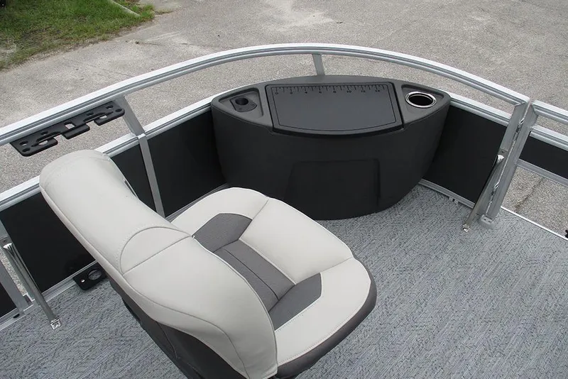 Slide: The Image of 2026 Sun Tracker Bass Buggy 18 DLX boat interior with seating and console. - 12