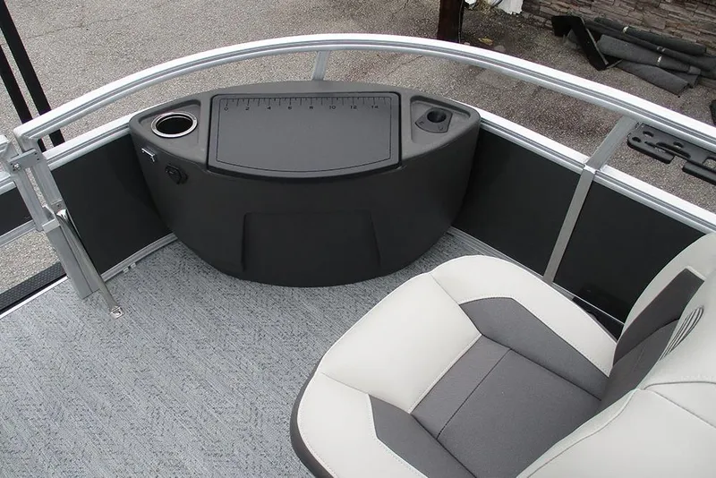 Slide: The Image of 2026 Sun Tracker Bass Buggy 18 DLX interior with seating and control panel. - 15