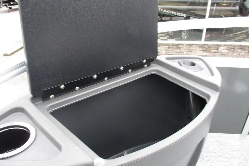 Slide: The Image of Open storage compartment on 2026 Sun Tracker Bass Buggy 18 DLX pontoon boat. - 16
