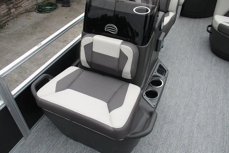 Slide: The Image of 2026 Sun Tracker Bass Buggy 18 DLX boat seat with cup holders and modern design. - 18