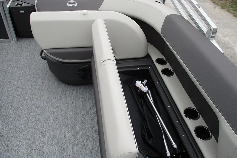 Slide: The Image of 2026 Sun Tracker Bass Buggy 18 DLX interior seating with storage and cup holders. - 22