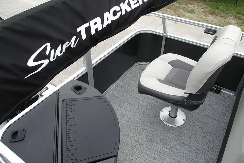 Slide: The Image of 2026 Sun Tracker Bass Buggy 18 DLX boat interior with seating and fishing station. - 25