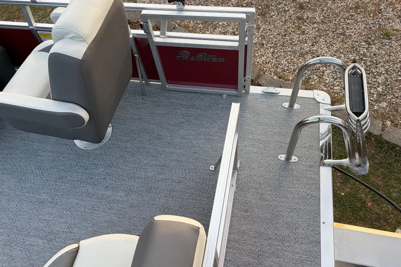 Slide: The Image of 2026 Sun Tracker Bass Buggy 16 XL Select pontoon boat interior with seating and ladder. - 74