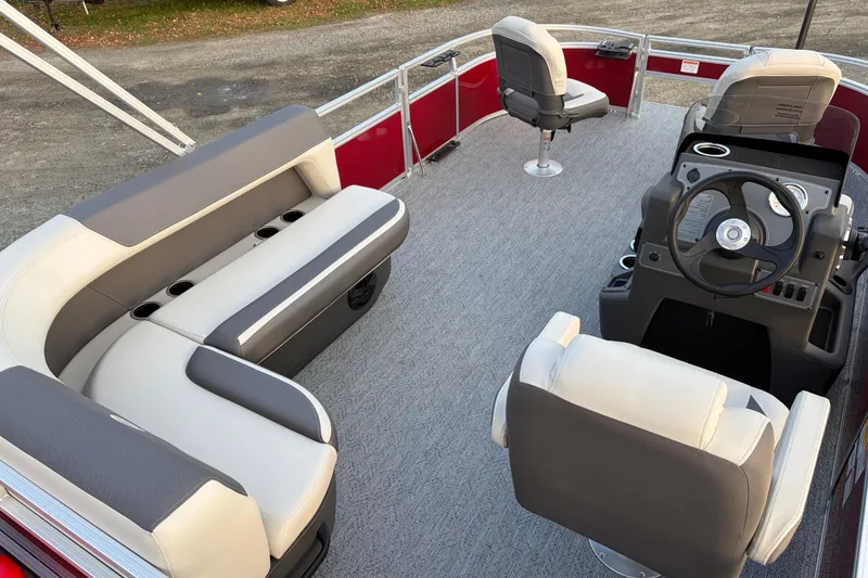 Slide: The Image of 2026 Sun Tracker Bass Buggy 16 XL Select interior with seating and steering console. - 76