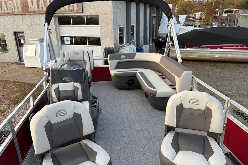 Slide: The Image of 2026 Sun Tracker Bass Buggy 16 XL Select pontoon boat with spacious seating and modern design. - 79
