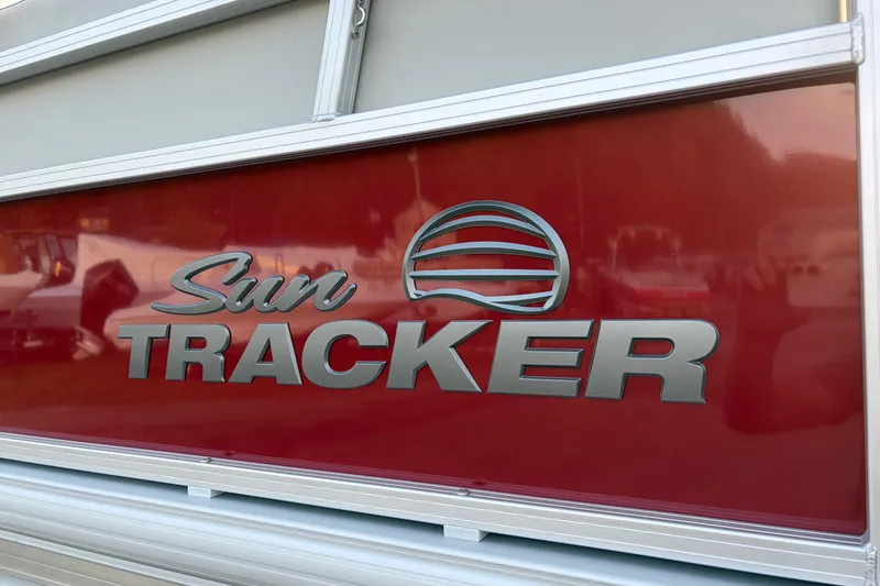 Slide: The Image of Sun Tracker Bass Buggy 16 XL Select 2026 logo on red background. - 85